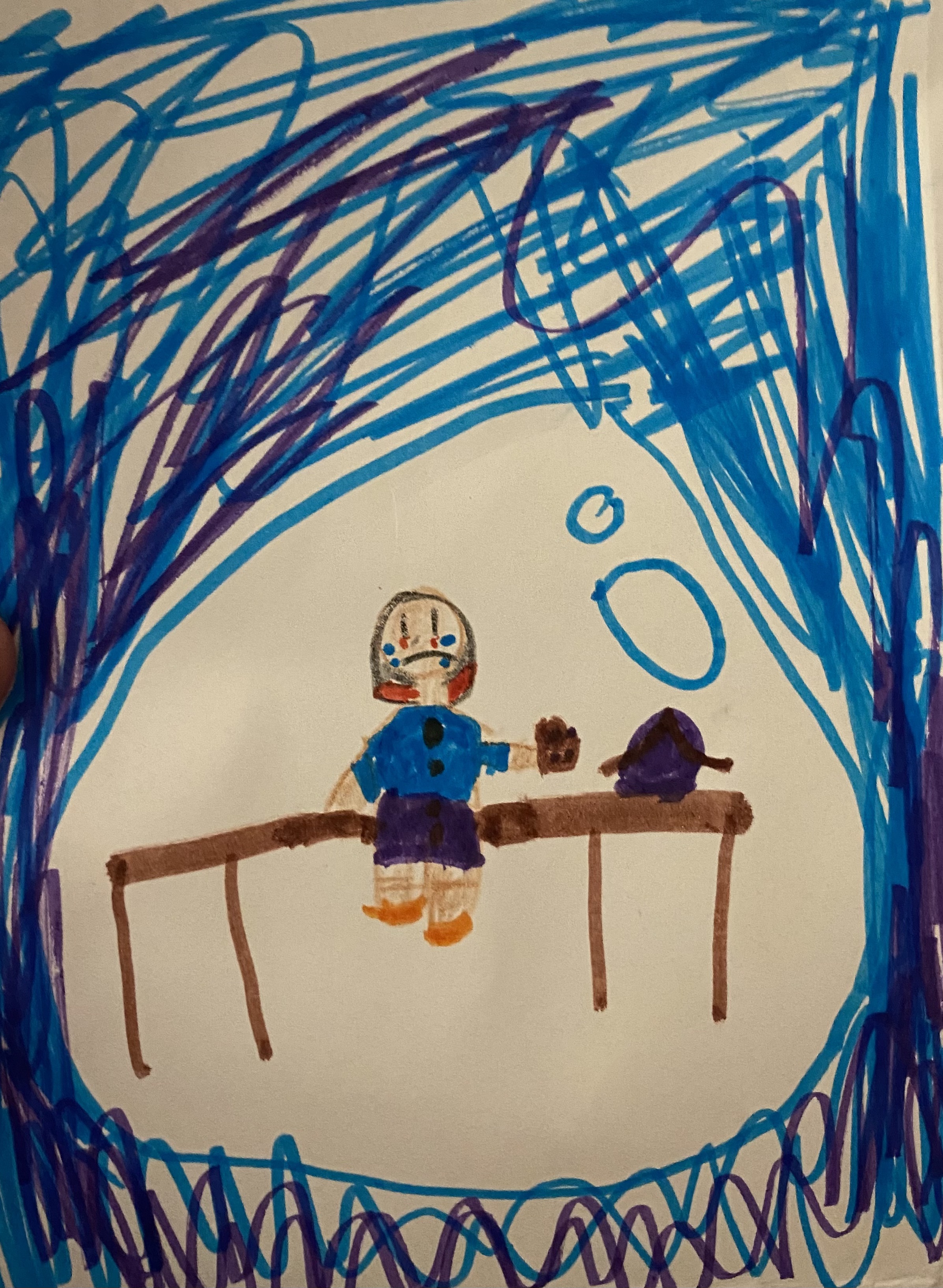 child's drawing of a child crying on a bench